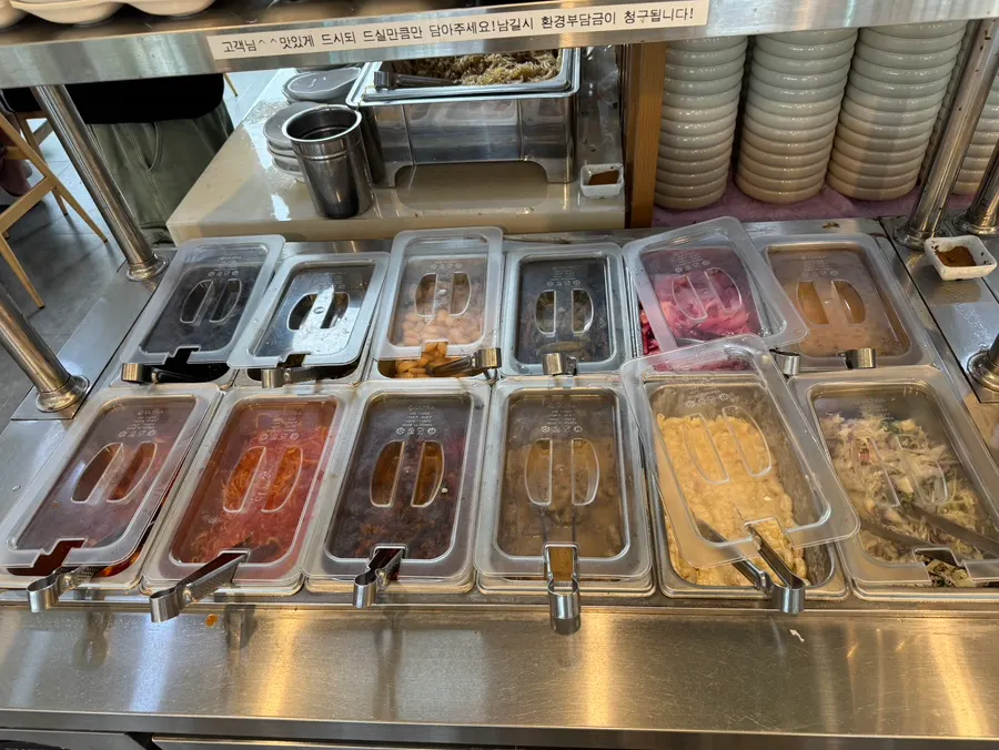 Self-serve bar with side dishes and ssam vegetables