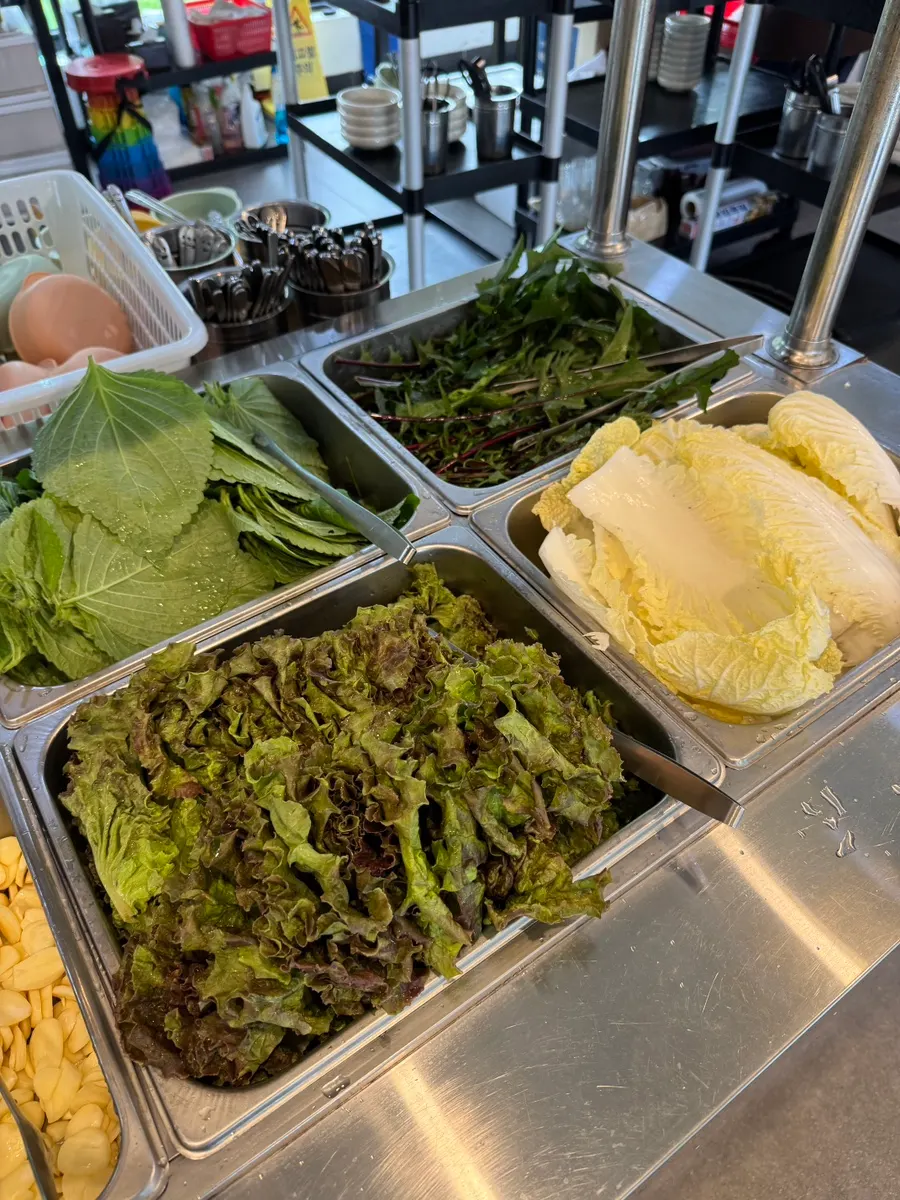 Kimchi, pickles, and other banchan at the self-serve bar
