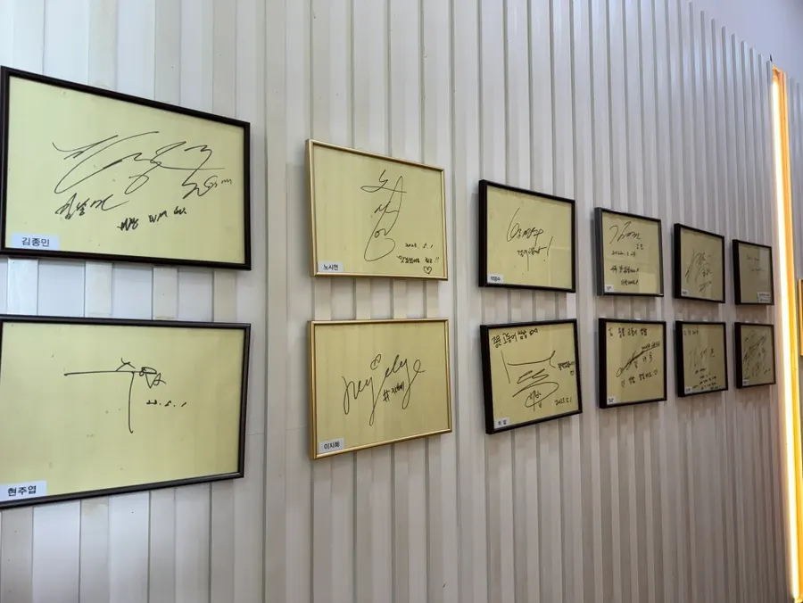 Restaurant wall covered in celebrity autographs