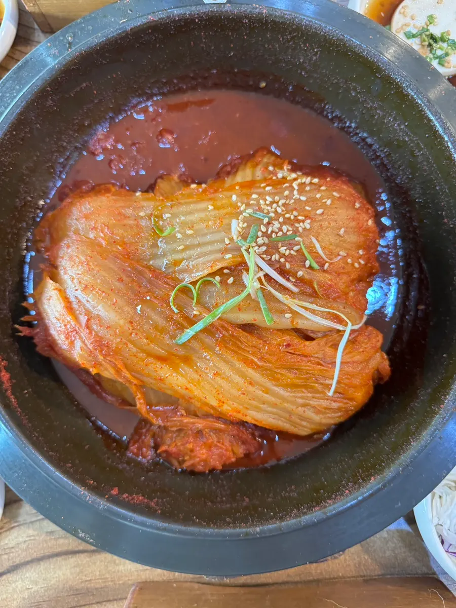 A whole hefty piece of old kimchi on top