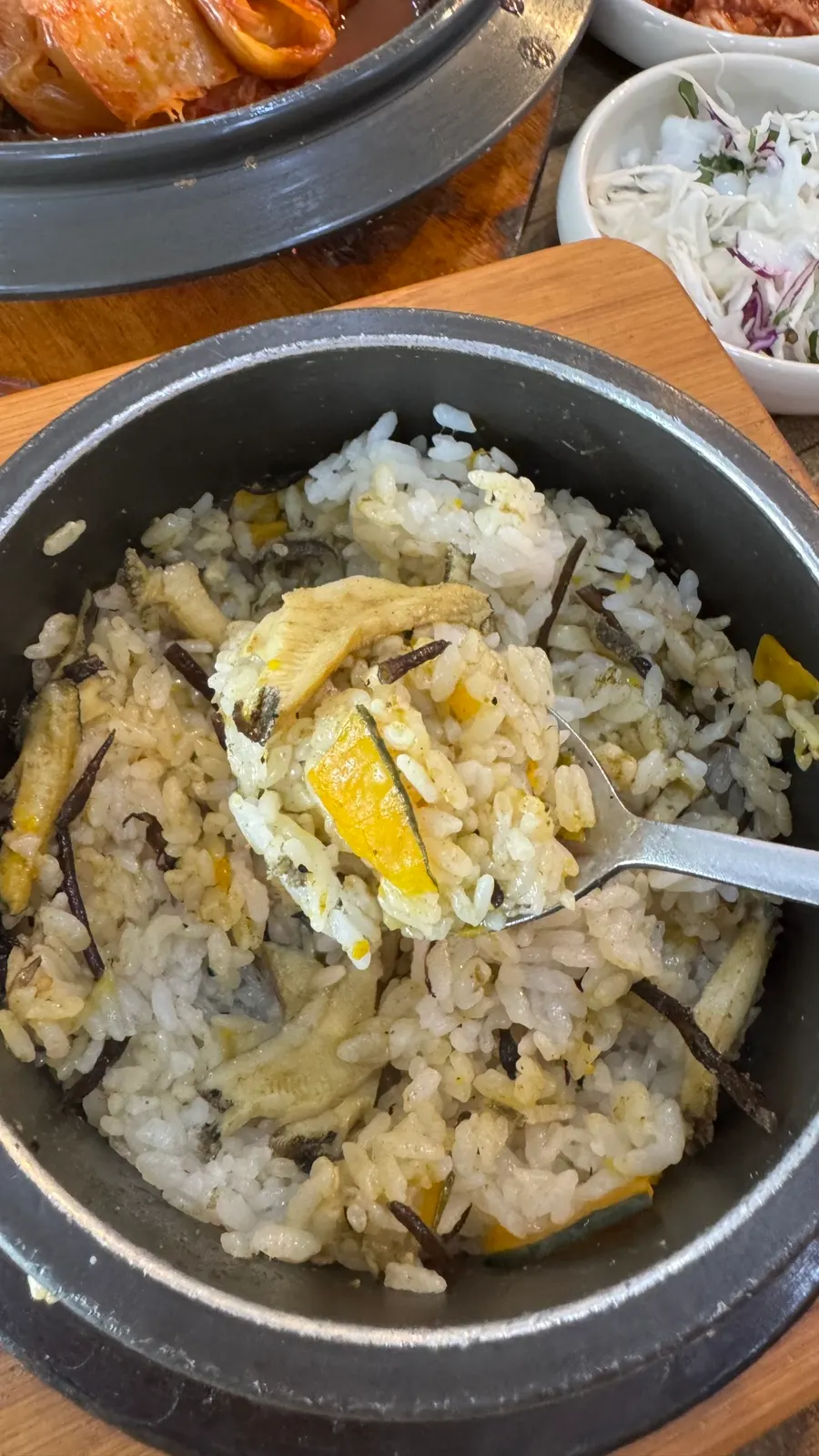 A big spoonful of abalone hot stone rice