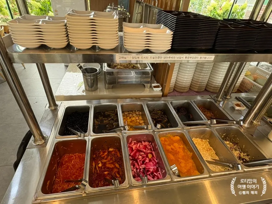 Self-serve bar where guests grab banchan and wrap veggies