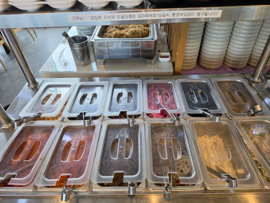 Self-serve side dish corner set up on one side of the restaurant