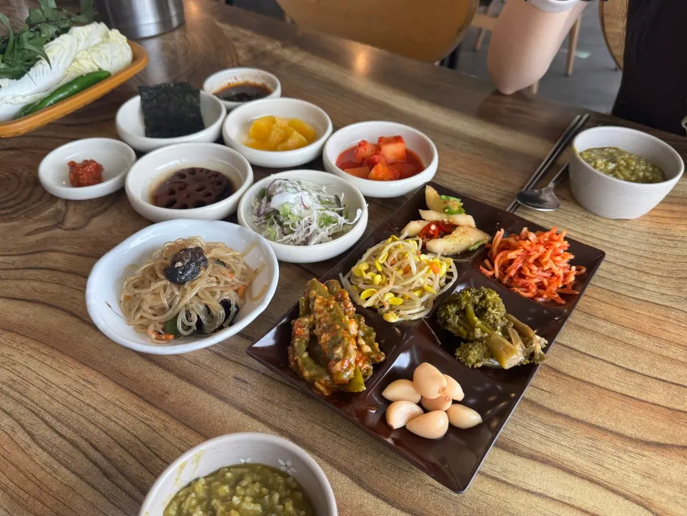 Table full of banchan gathered from the self-serve bar