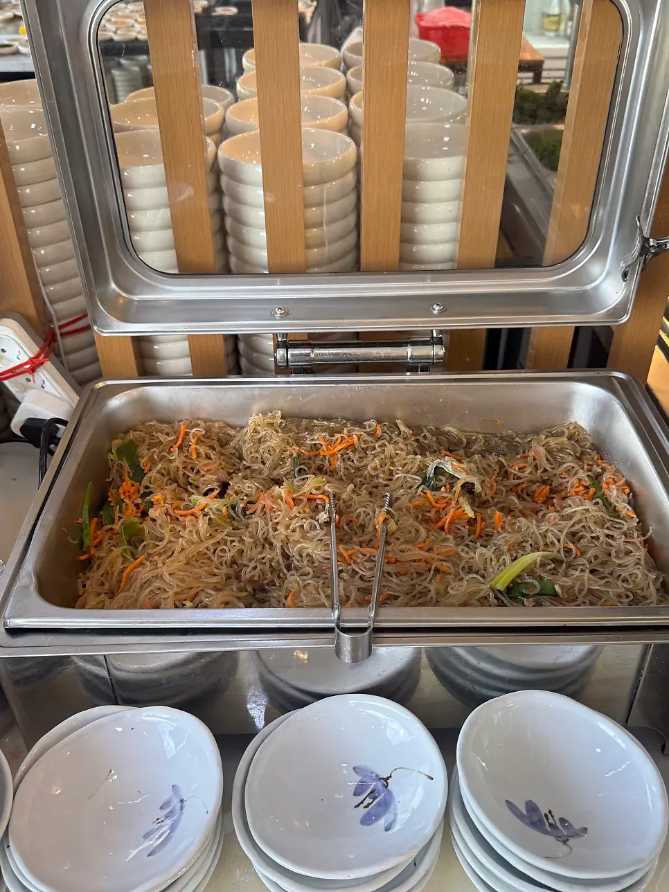 Black pork stir-fry laid out at the self-serve bar