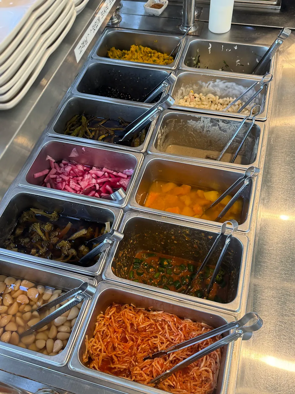 Japchae and side dishes at the self-serve bar
