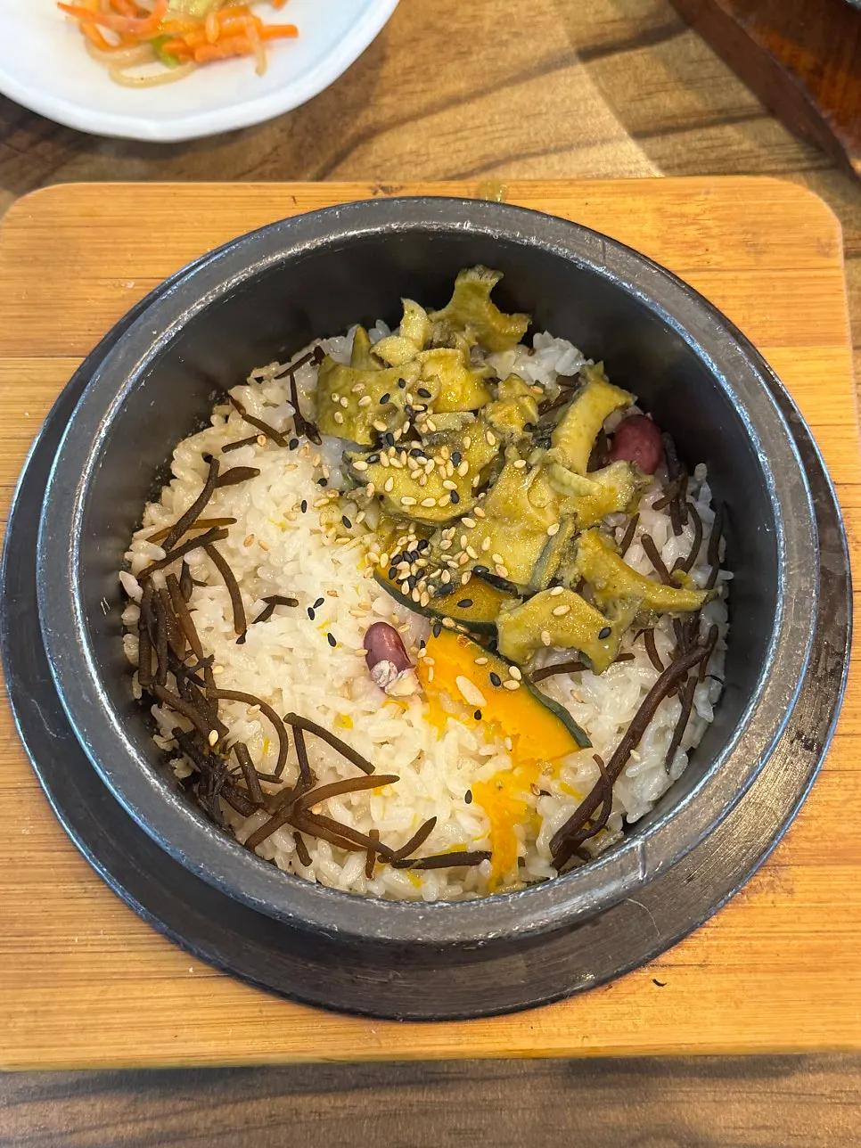 Abalone hot-pot rice topped with abalone, tot, and sweet pumpkin