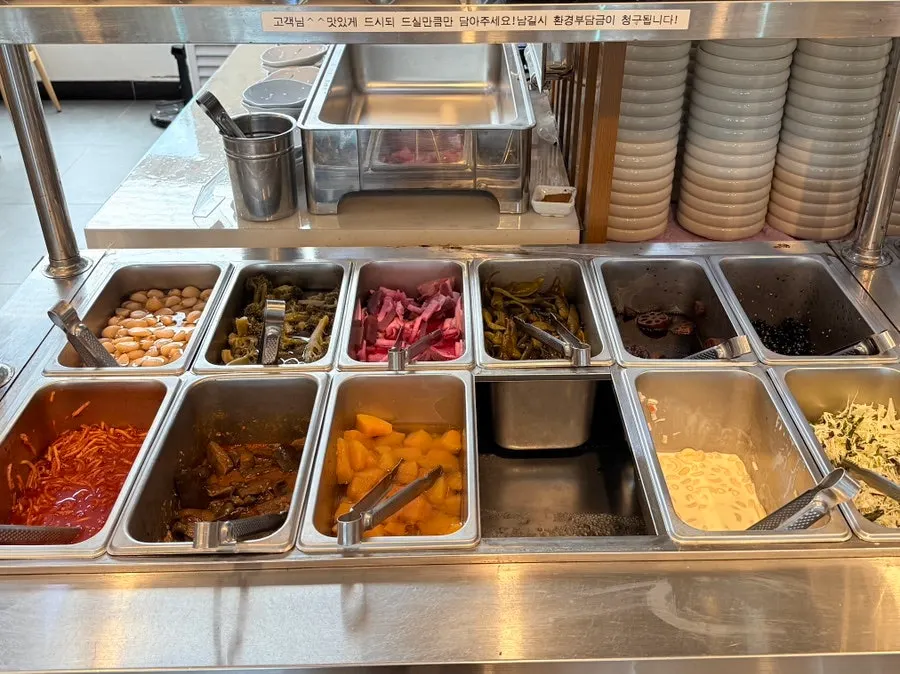 The black pork jeyuk section of the self-serve bar