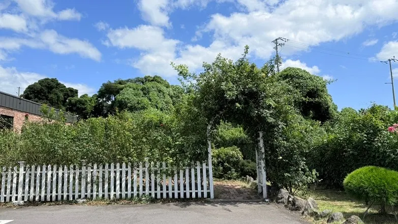 Entrance to the outdoor rose garden at Jungmun Godeungeo Ssam-bap