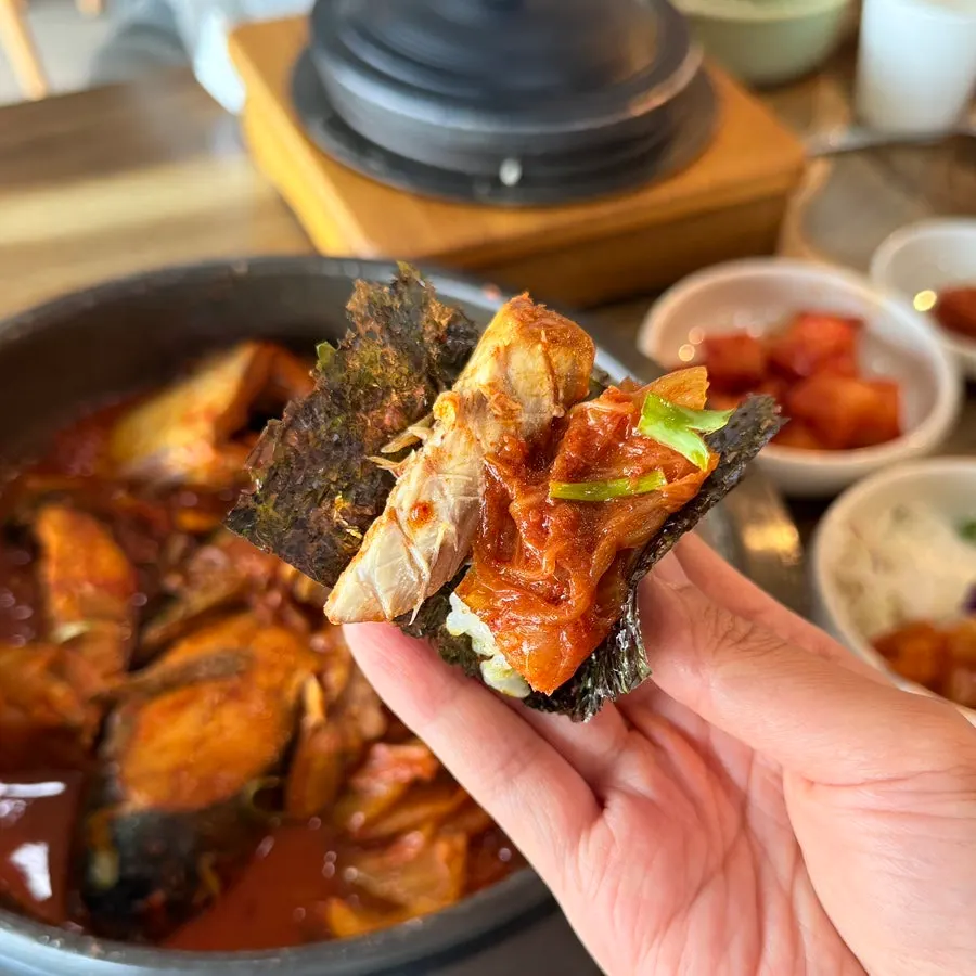Table setting at the end of the meal with braised mackerel and banchan