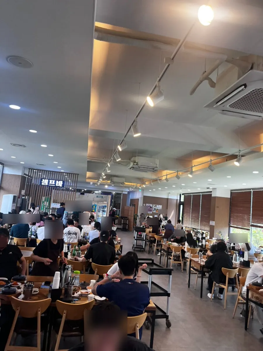 Interior seating at Jungmun Godeungeo Ssam-bap before the lunch rush