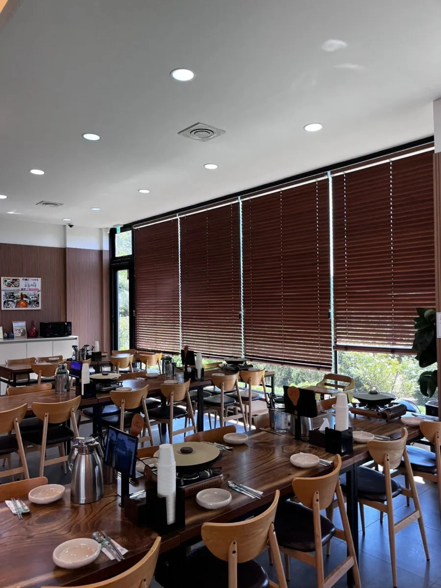 Spacious dining hall with reserved tables at Jungmun Godeungeo Ssam-bap