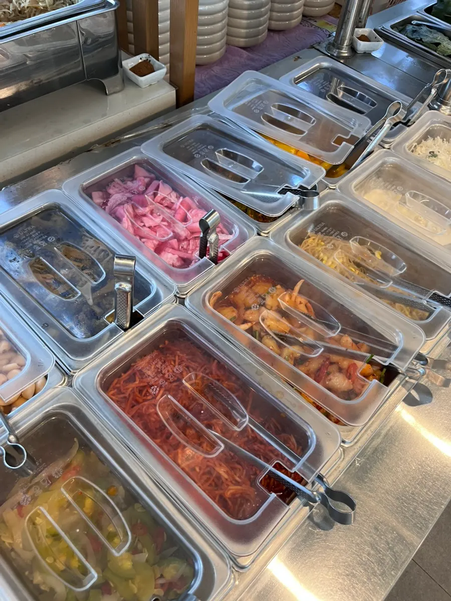 Self-serve bar stocked with a variety of side dishes