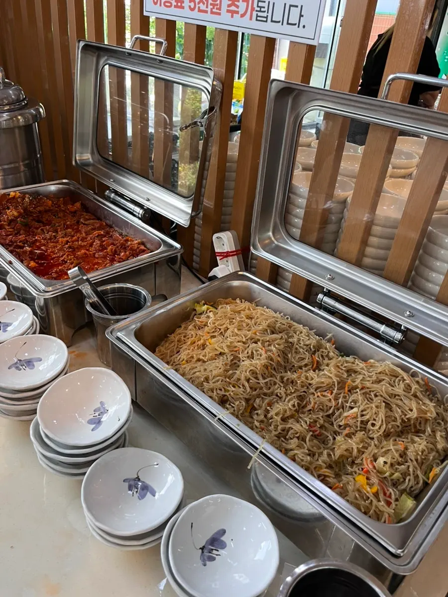 Self-serve bar with ssam vegetables and jeyuk-bokkeum