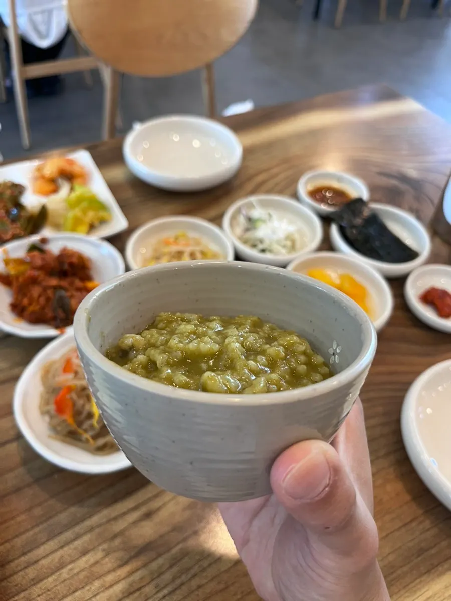 Full spread of abalone porridge, jeyuk-bokkeum, and japchae