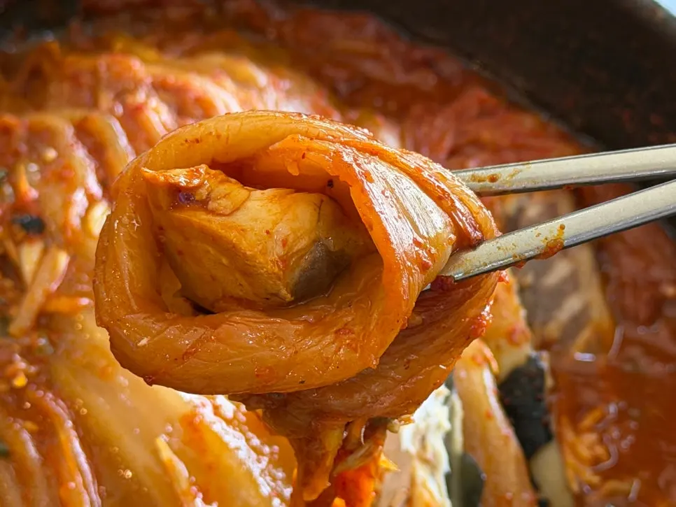 Large mackerel tucked inside the old kimchi