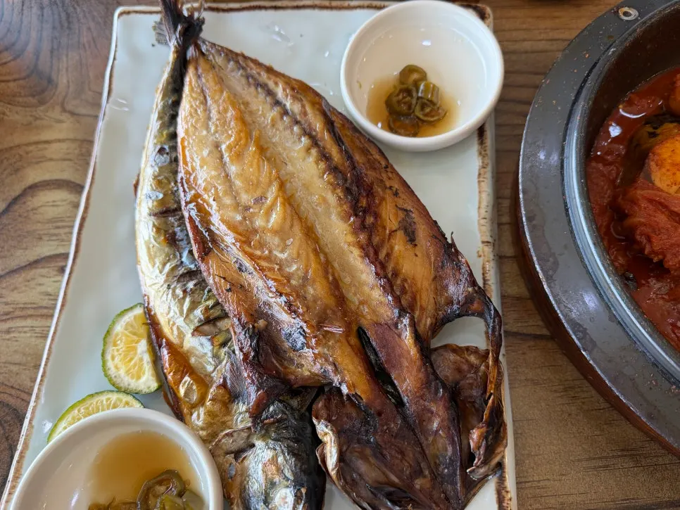 Two mackerel grilled to a golden brown