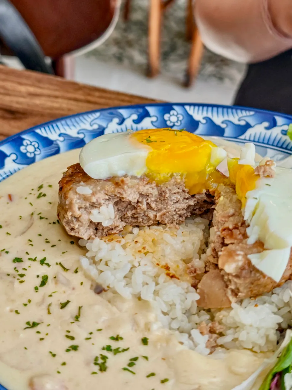 Garlic cream hambak with fried egg on top and rice underneath
