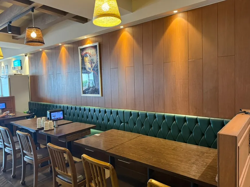 Dining hall tables under calm, soft lighting