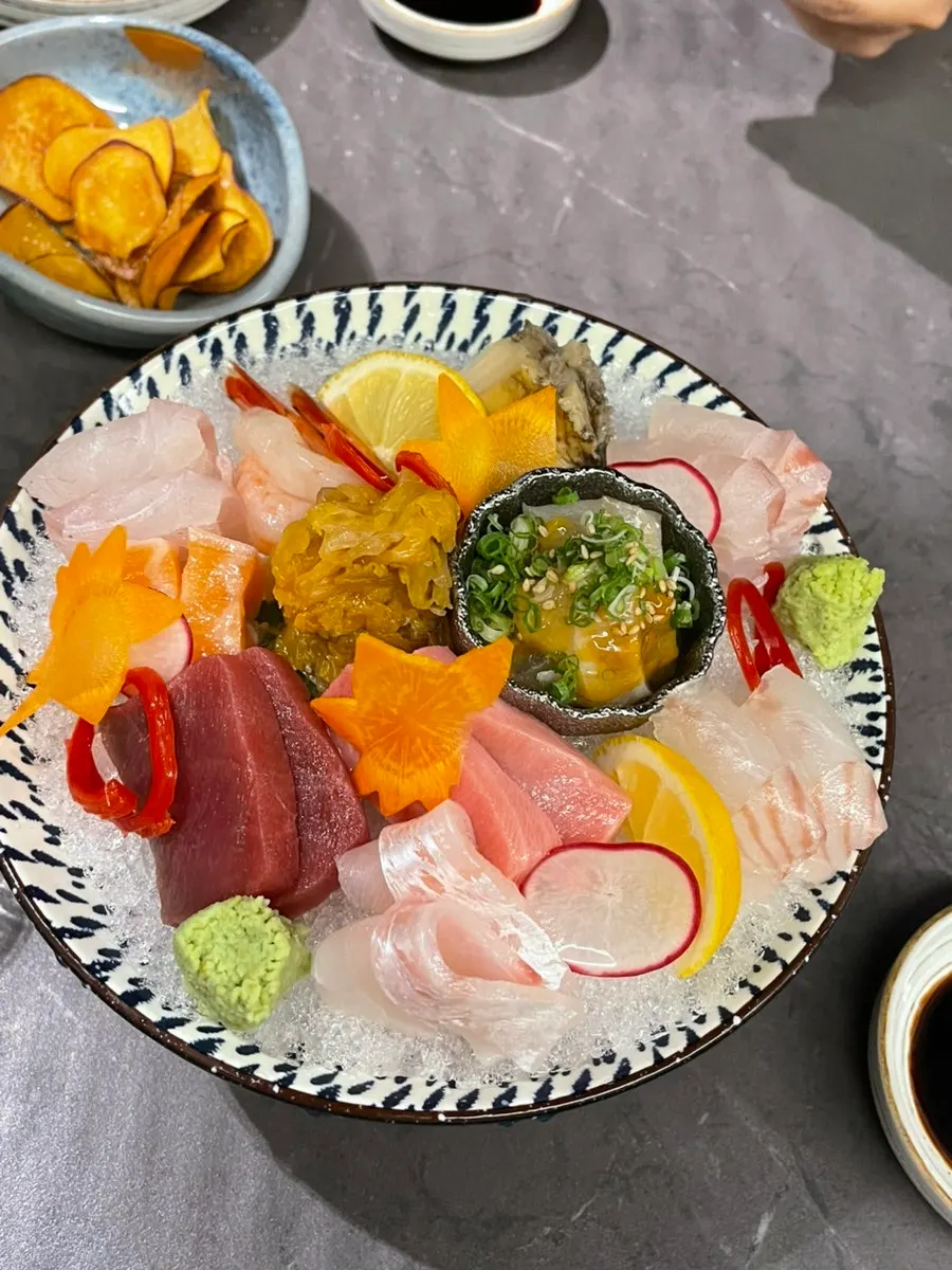 Domestic aged kimchi aae served alongside the sashimi