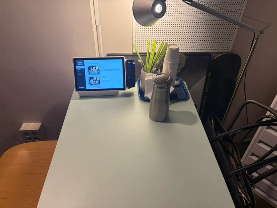 Cute tables and chairs with wall posters