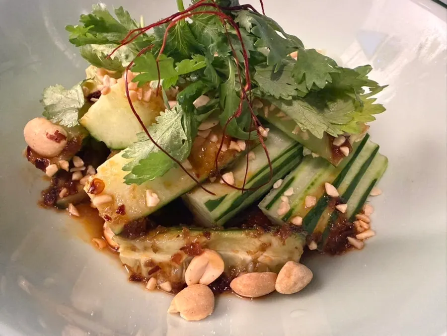 Cilantro served alongside the cucumber salad