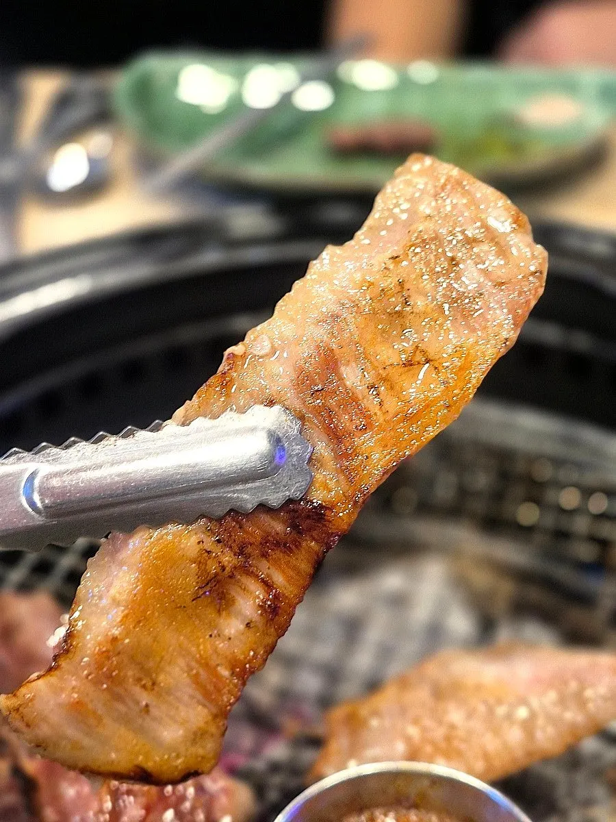 Sliced piece of grilled Iberico pork jowl