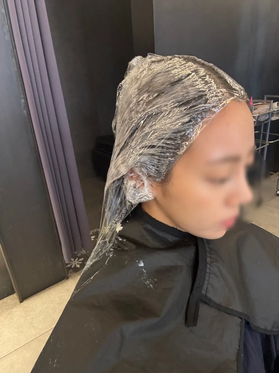 Hair wrapped and waiting after color application