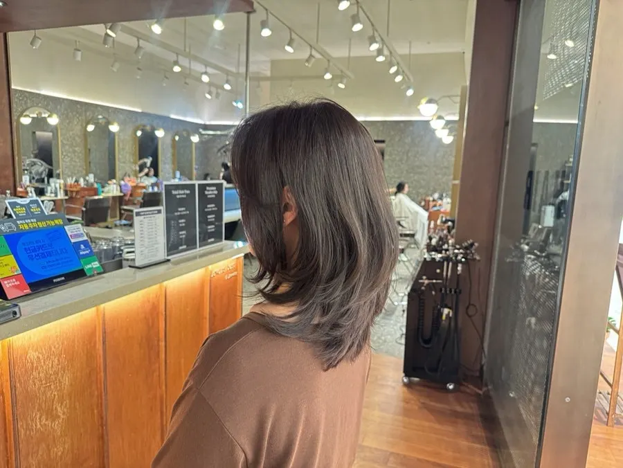 Finished medium-length hair tidied with a layered cut