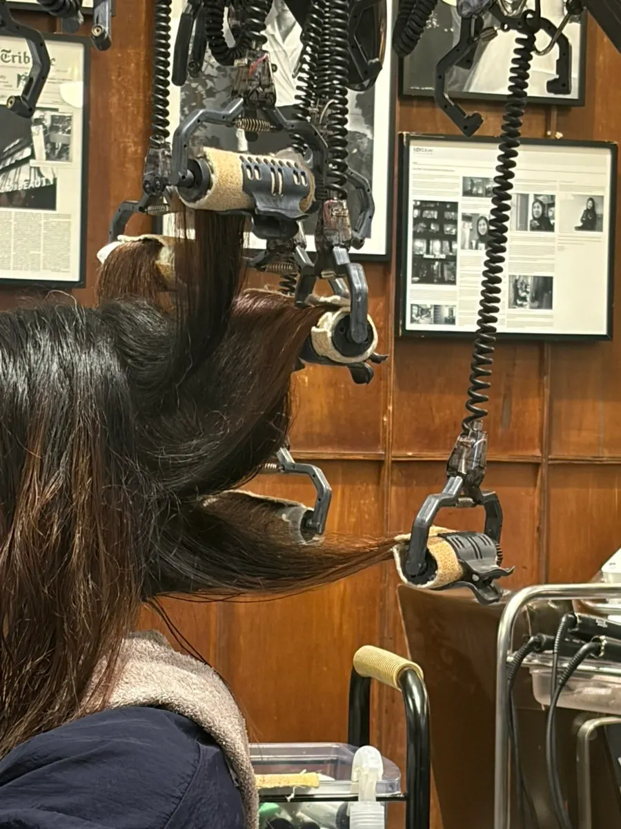 Hair fully rolled with rods mid-way through the magic setting