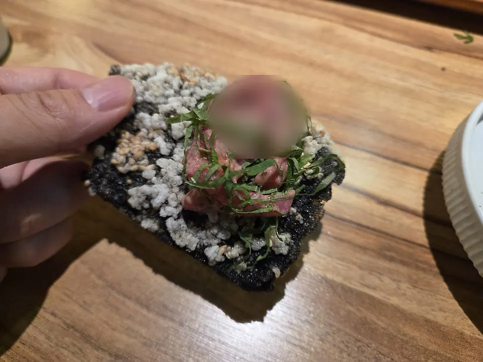 A single bite-sized portion of beef tartare