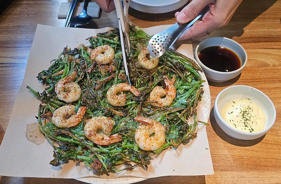 Crispy shrimp minari pancake served at the table