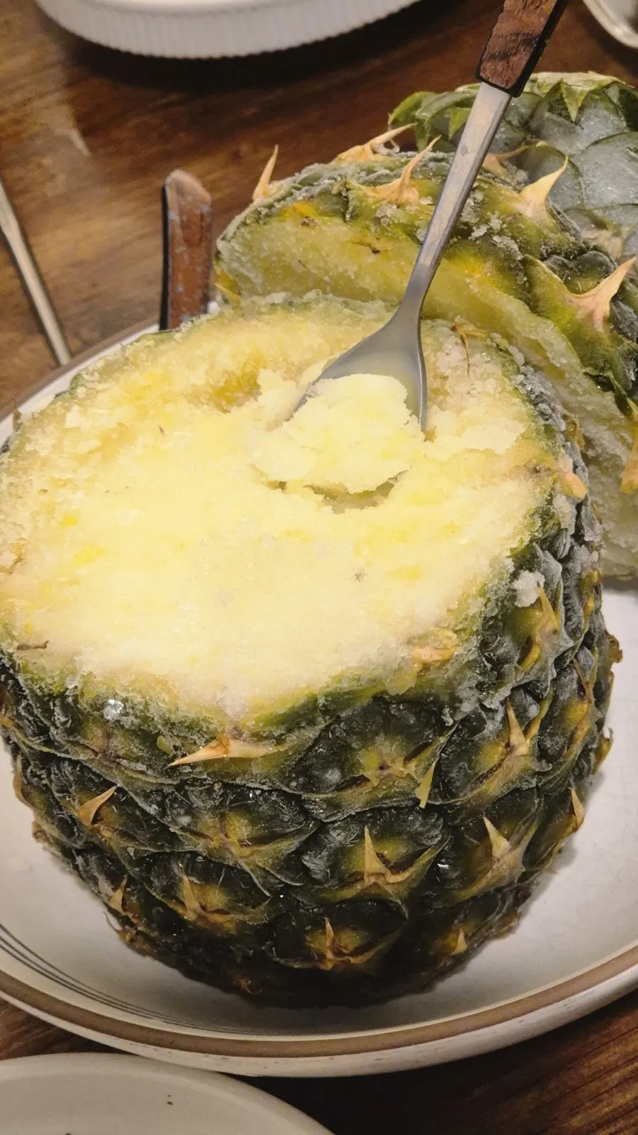 Pineapple sherbet served in a pineapple shell