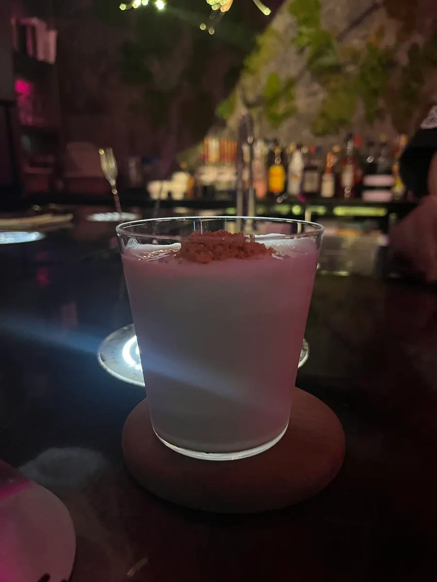 Rat cocktail topped with brown cheese