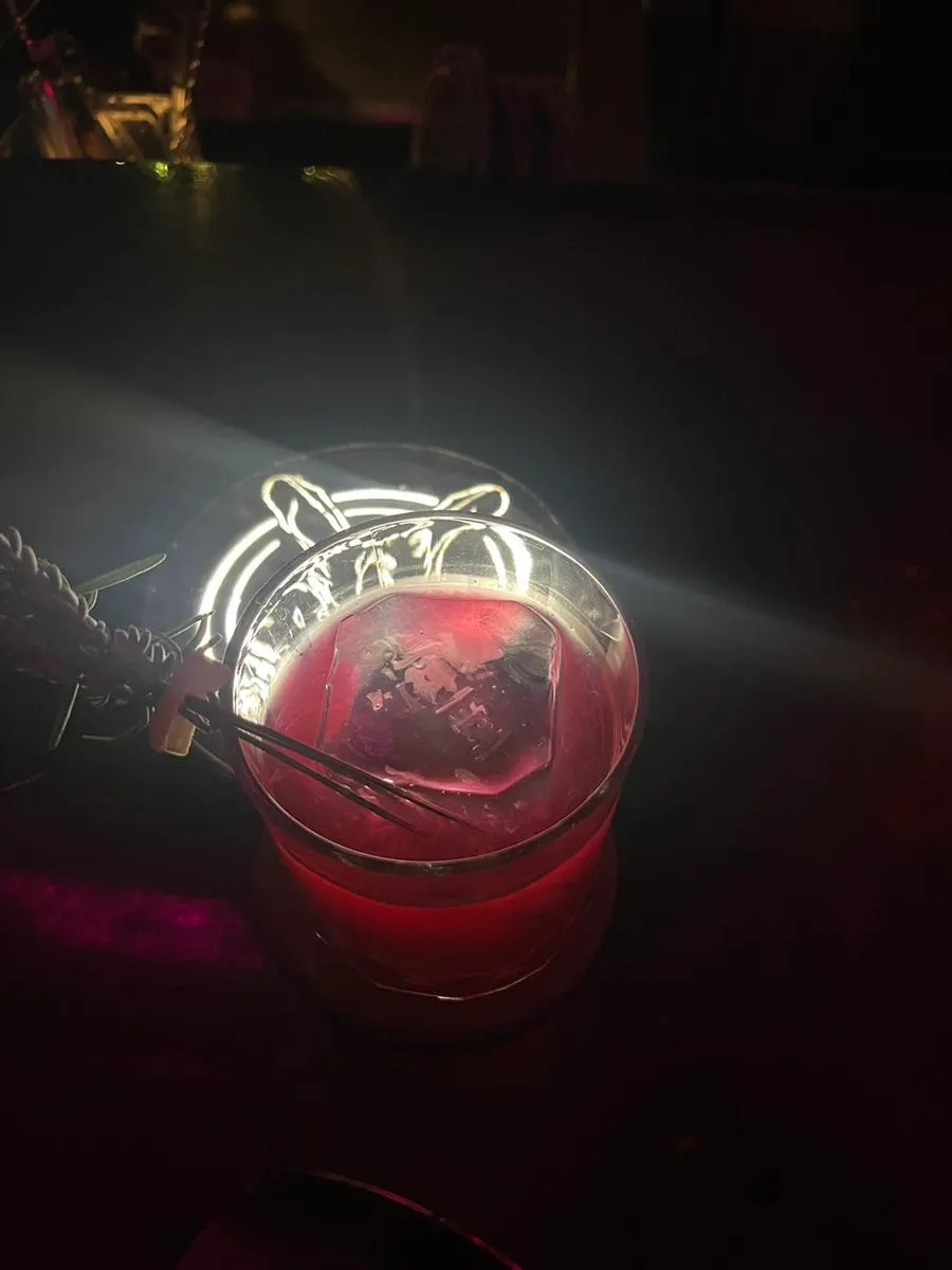 Dragon cocktail with the Jusindang logo carved into the ice