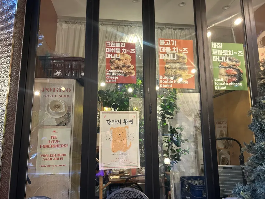 Store wall with signature poke and panini menu banners