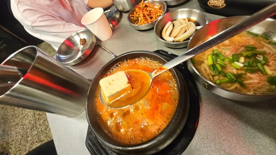 Rich doenjang jjigae served alongside the meat