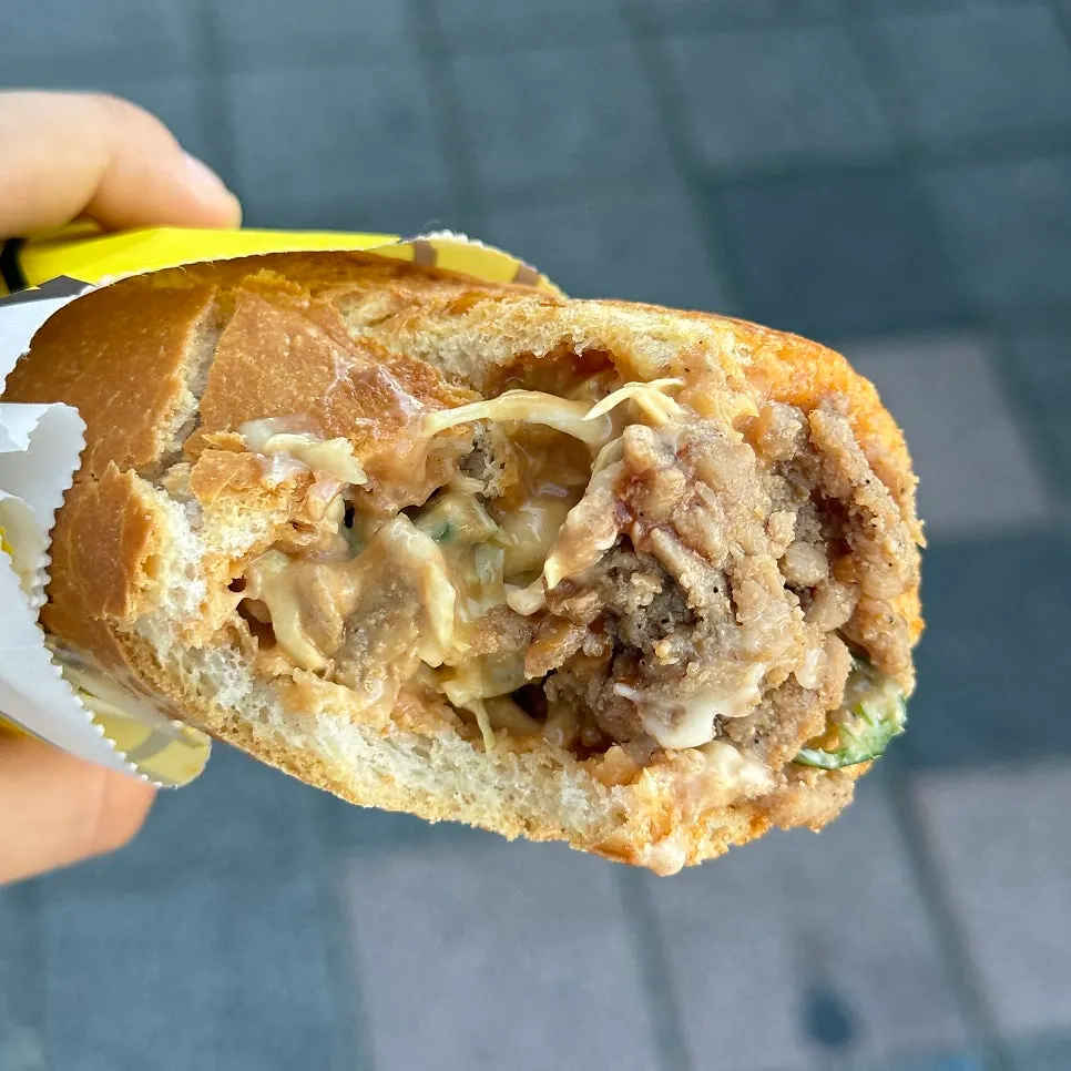 Cross-section of the baguette burger showing chili