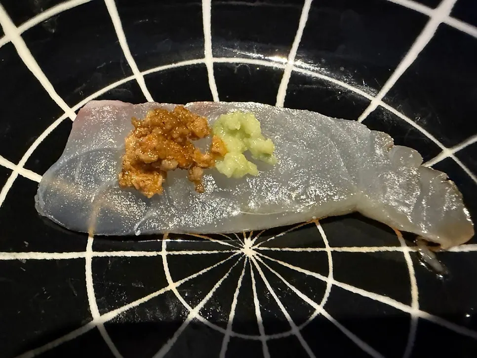 Sashimi topped with anago liver and wasabi