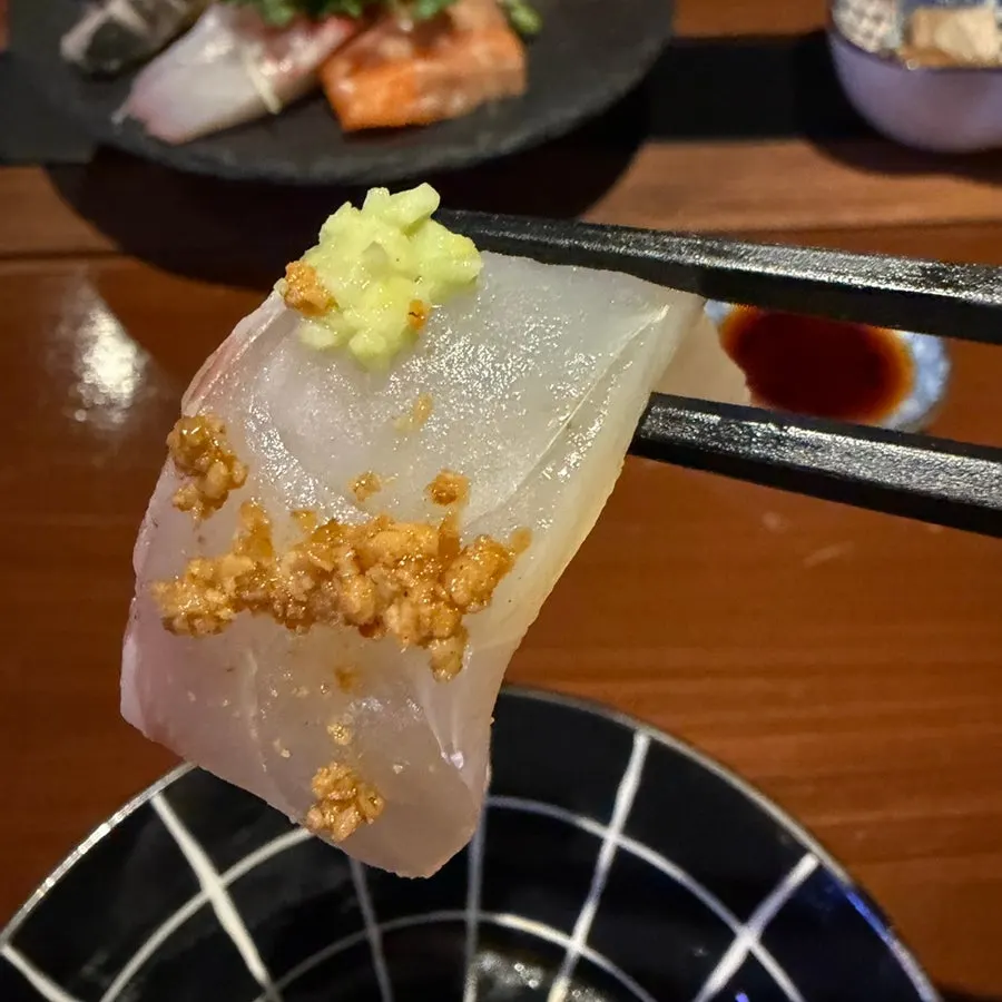 Sashimi plate with soy sauce, wasabi, and pickled ginger