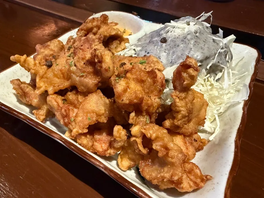 Karaage served with black sesame dressing cabbage