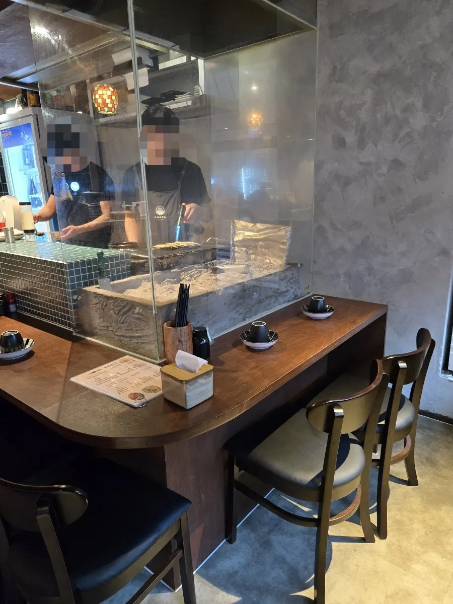 Kaken's dachi bar seats and kitchen view