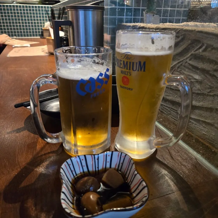 Glasses of Cass and Suntory draft beer at Kaken