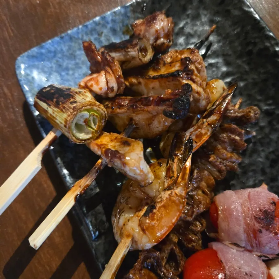 Skewers being grilled, viewed from the dachi bar seats