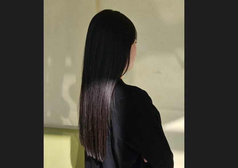 Close-up of smooth, shiny hair after straightening