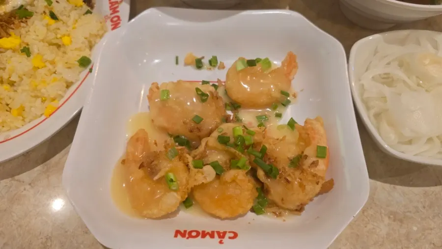 Kkamon fried rice served at a table with a child eating well