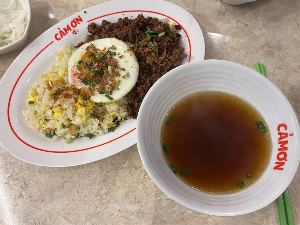 Pho broth served alongside the fried rice