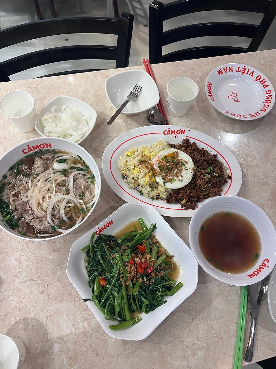 Group shot of pho, fried rice, and water spinach stir-fry