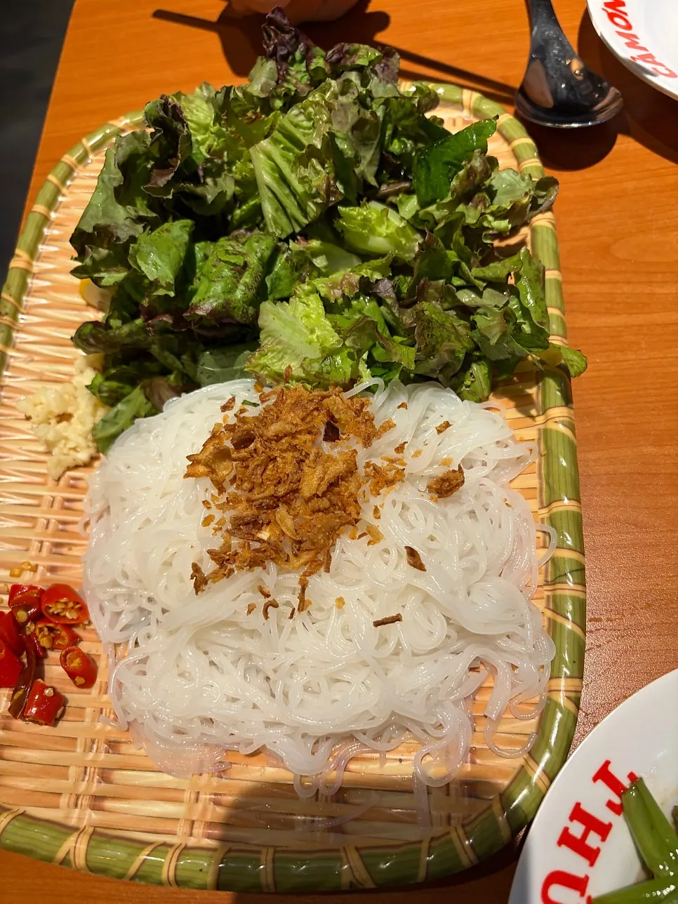 Table spread with pho and side dishes together