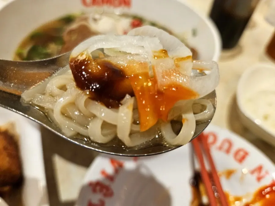 Full table setting of pork backbone pho